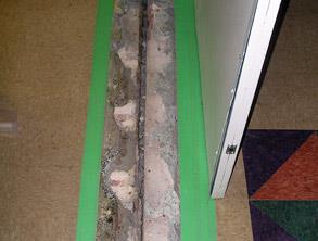 Damaged expansion joint causing a trip hazard in a hospital
